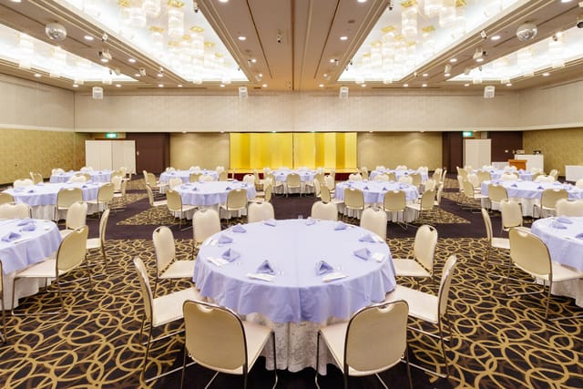 Magnolia Hall at Tokyo Prince Hotel, elegant round tables set for weddings and galas.