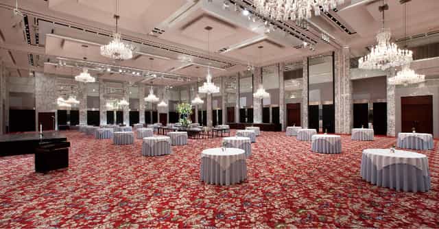 Elegant banquet hall at Tokyo Prince Hotel with blue linens, ideal for corporate events.
