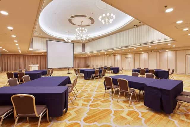 Banquet hall at Tokyo Prince Hotel with elegant chandelier, ideal for meetings and conferences.