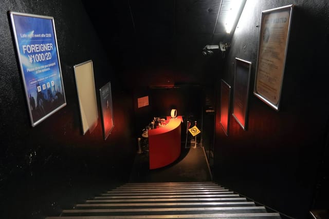 Dimly lit staircase at Club Asia's 1F Lounge, perfect for private events and gatherings.