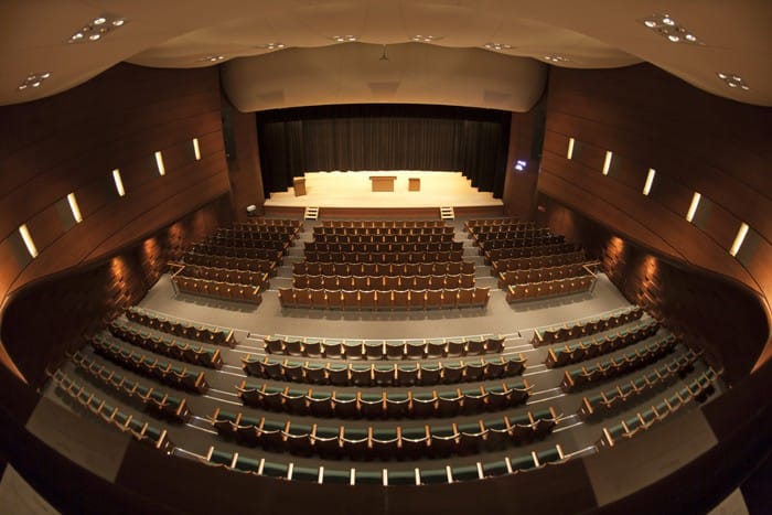IINO HALL auditorium with tiered seating for corporate meetings and cultural events.