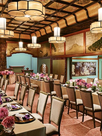 Elegant event space in Hotel Gajoen Tokyo with floral centerpieces for upscale gatherings.