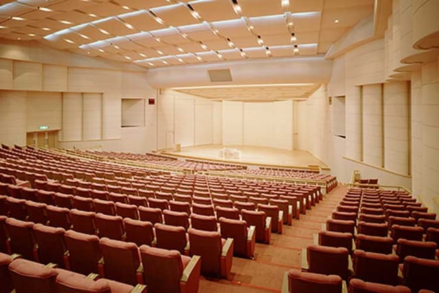 Spacious auditorium with tiered seating at PACIFICO Yokohama for conferences and events.