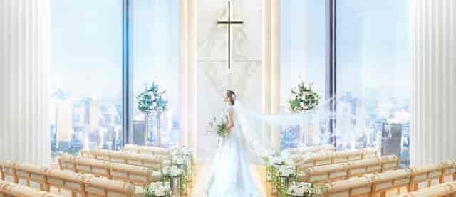 Elegant wedding venue at InterContinental Tokyo Bay with city skyline backdrop.