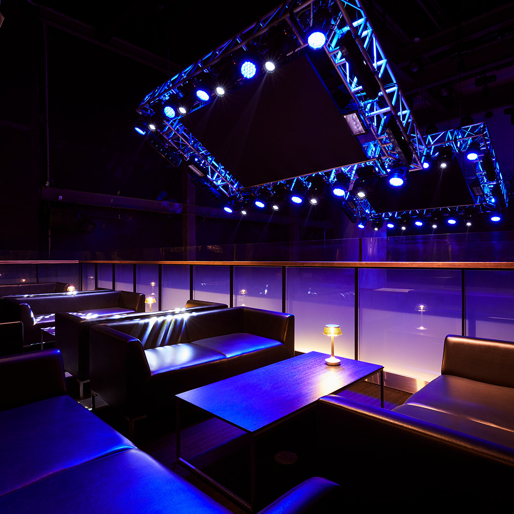 Premium Lounge in WOMB: modern event space with stylish seating, ideal for networking and receptions.