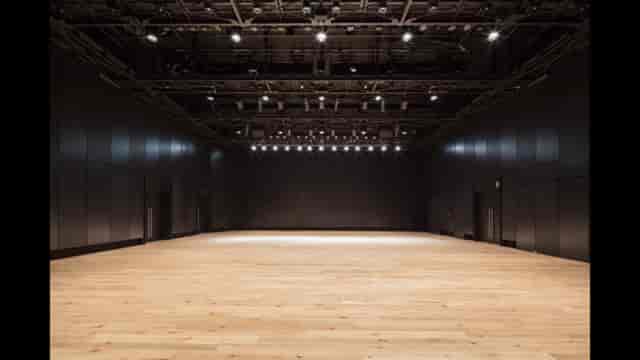 Spacious Harajuku Hall with polished wooden floor, ideal for versatile events and conferences.