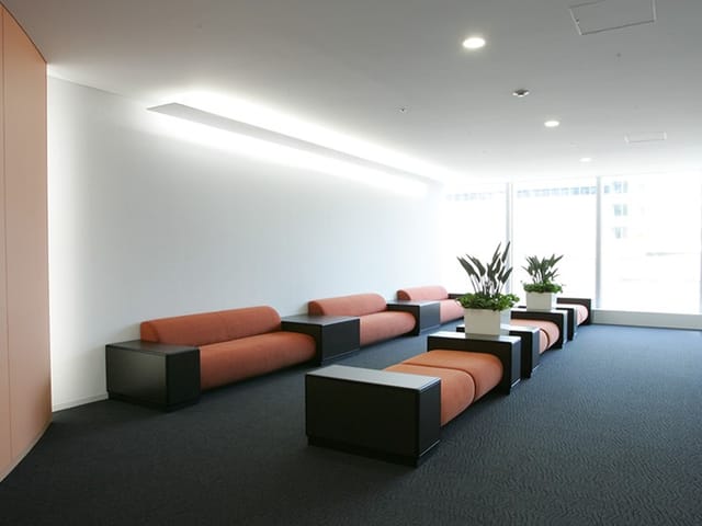 Modern lounge area in UDX Conference Room F, perfect for networking and events.
