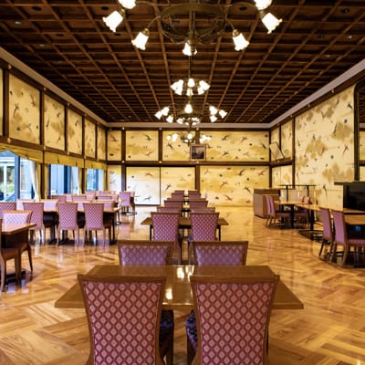 Elegant meeting room in Meiji Kinenkan with warm wooden ceiling, perfect for events.