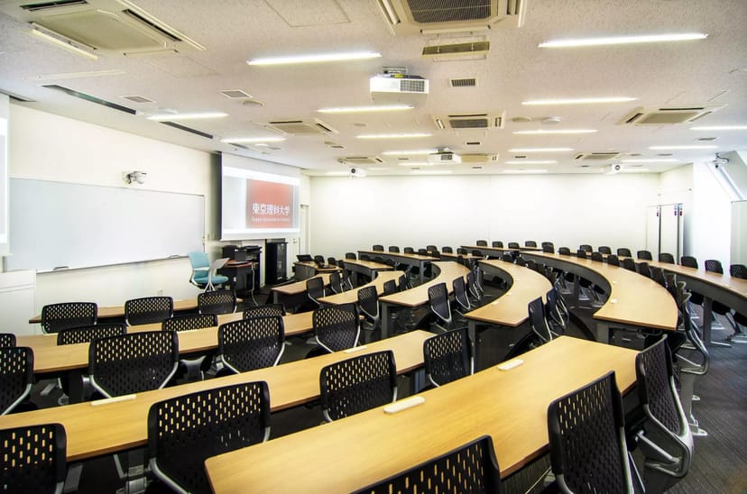 Tokyo School of Business classroom with curved seating for workshops and seminars.