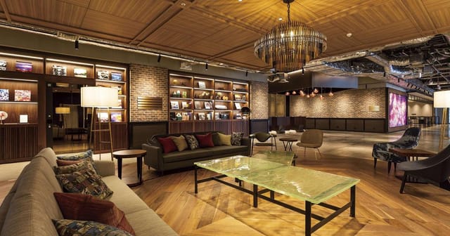 Stylish SHIBUYA STREAM Hall event space with warm wood tones for networking and meetings.