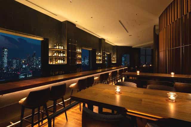 Rooftop bar at Cerulean Tower Hotel with city view, ideal for corporate events and gatherings.