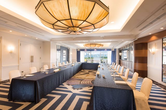 Conference center in Hilton Tokyo Odaiba with elegant blue linens, ideal for meetings.