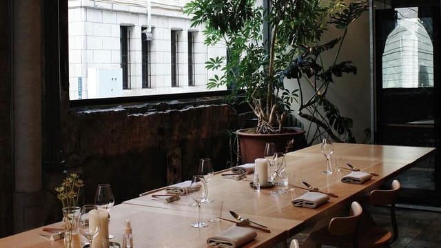 Private meeting room with wooden table, ideal for corporate events and gatherings.