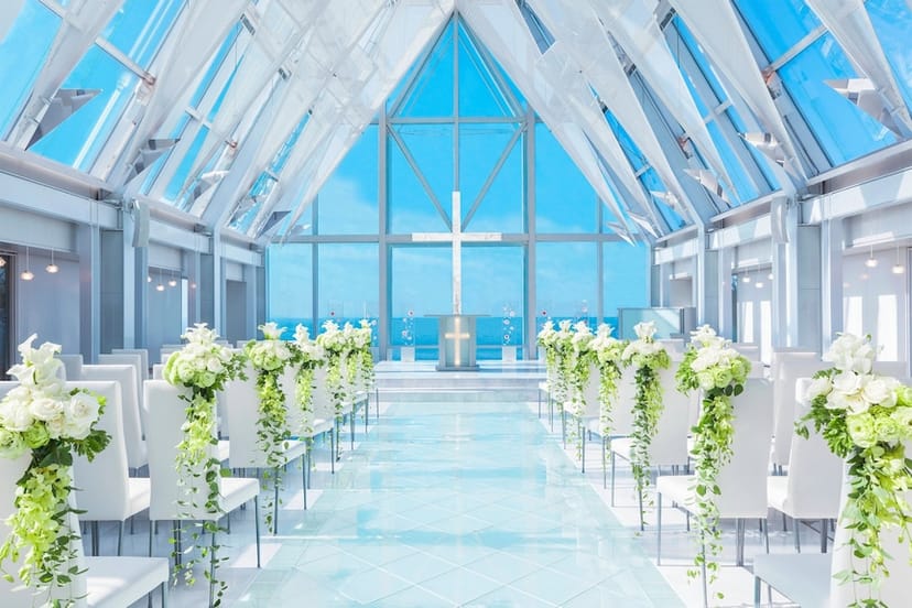 Elegant wedding venue with floral decor and panoramic views at Sheraton Grande Tokyo Bay.