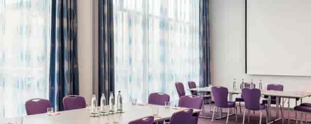 Meeting Room 1 in Nhow Berlin with modern purple chairs, ideal for professional events.