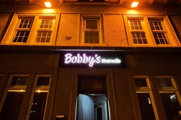 Bobby's Bar exterior in Newcastle, warm lighting, trendy venue for events and gatherings.