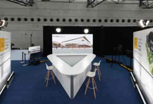 Modern meeting room in Reims Congress with triangular stage for impactful events.