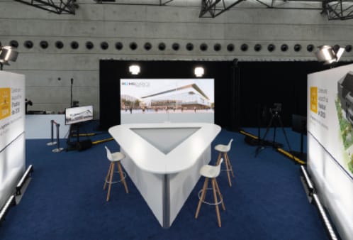 Modern meeting room in Reims Congress with triangular stage for impactful events.