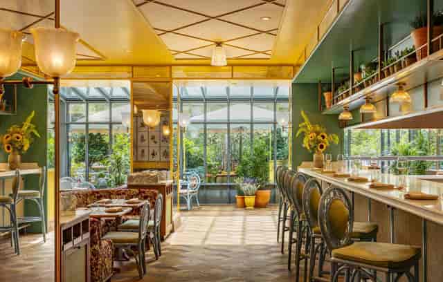 Vibrant event space in La Fantaisie, ideal for networking and gatherings with greenery.