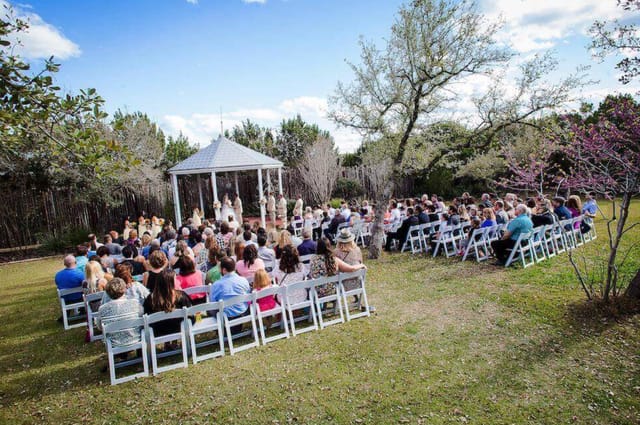 Outdoor wedding ceremony at Star Hill Ranch with gazebo and lush greenery.
