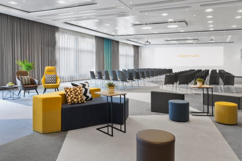 Modern event space in Courtyard Zurich North with flexible seating and natural light.