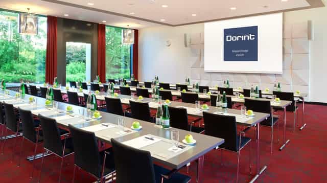 Airbus corporate event in modern Zurich meeting room with natural light and fresh apples.