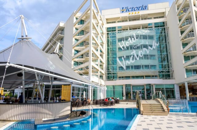 Modern Grand Hotel Victoria with sleek exterior and inviting pool for events.
