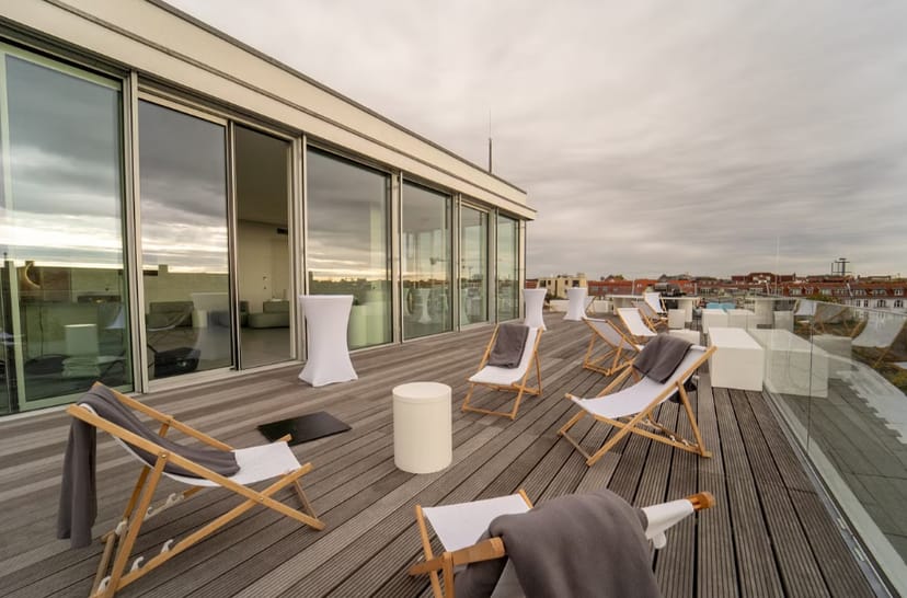 Stylish rooftop venue with panoramic views for networking events and cocktail receptions.