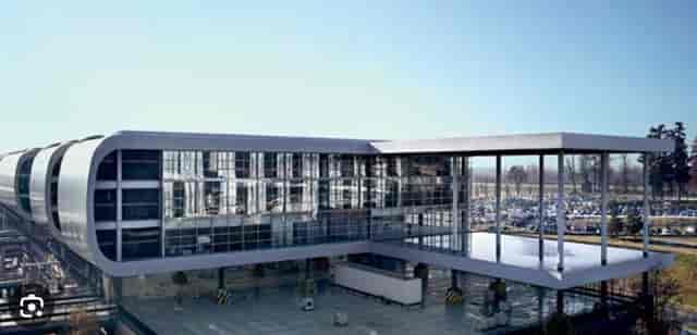 Modern event venue Pegasus B at Sheraton Milan Malpensa with glass facades for conferences.