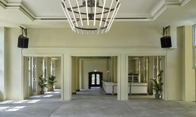 Spacious Zenner event venue with modern design, ideal for corporate and private gatherings.