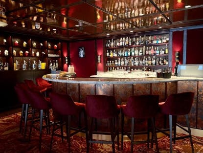 Sophisticated bar setup with rich decor for networking events in Sael London.
