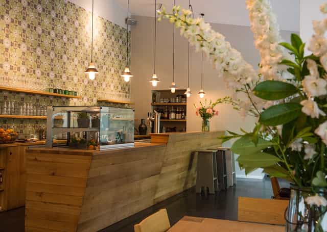 Stylish MARS Café & Bar with warm wood tones, ideal for networking events and meetings.