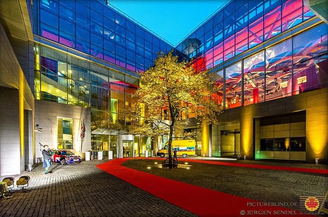 Vibrant ARTrium courtyard with red carpet, ideal for corporate events and galas.
