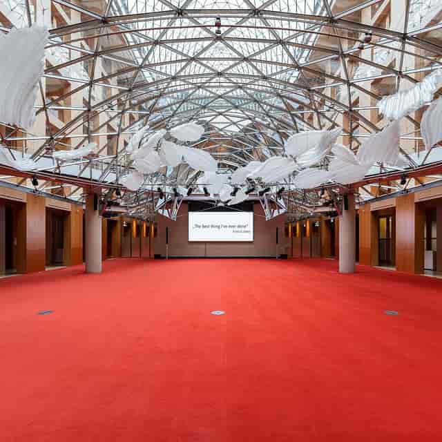 Spacious AXICA event venue with high ceiling, ideal for conferences and workshops.