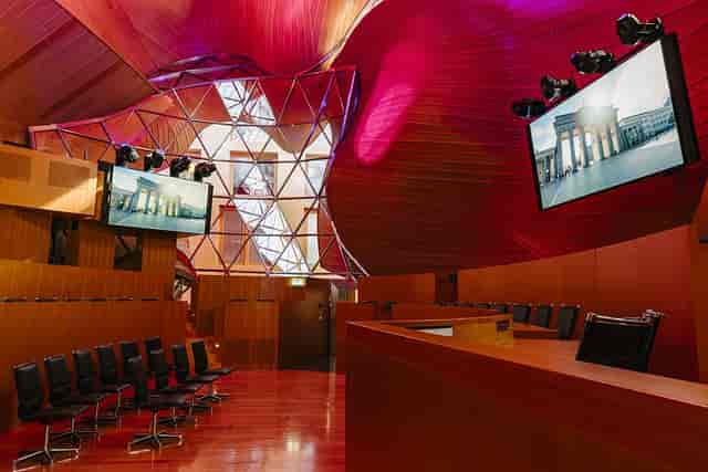 Modern event space with wooden interior, ideal for conferences and presentations.