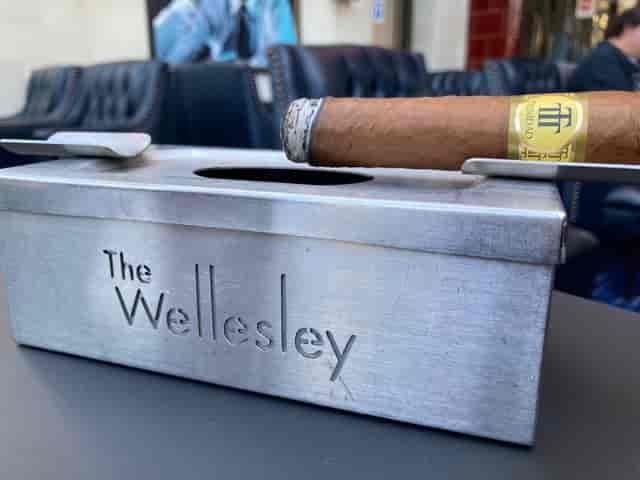 Cigar box and premium cigar at The Wellesley, luxury venue for upscale events.