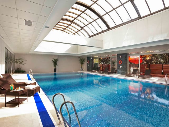 Modern indoor pool at Novotel Ambassador Seoul Gangnam, ideal for upscale events and relaxation.