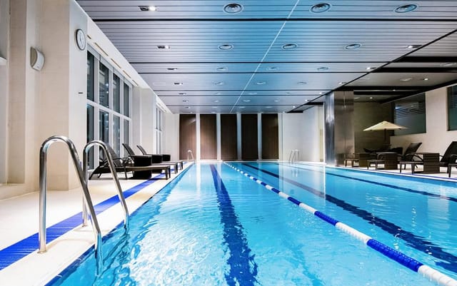 Modern indoor pool at LOTTE City Hotel Mapo, ideal for events and wellness retreats.