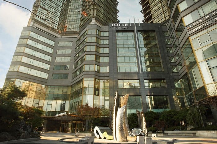 Modern LOTTE City Hotel Mapo with sleek glass facade, perfect for corporate events.