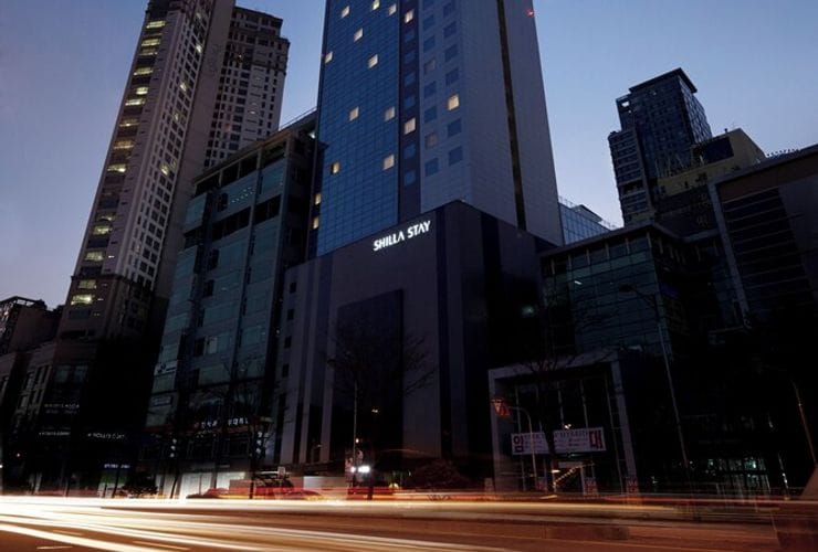 Modern hotel exterior at dusk, perfect for conferences and meetings in Dongtan.