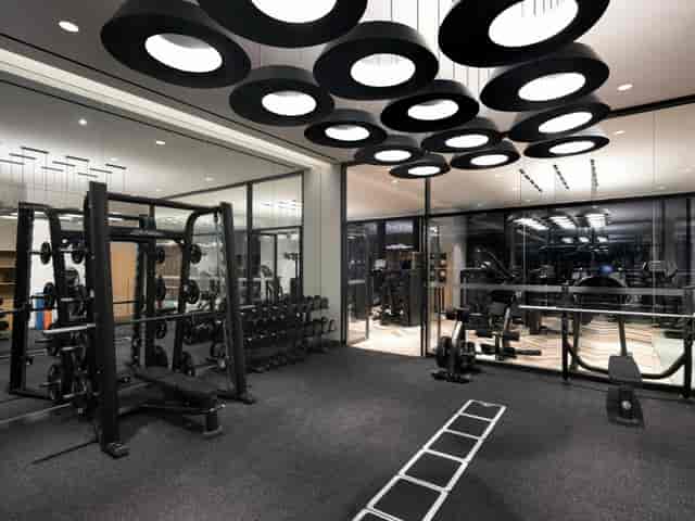 Modern fitness center in Novotel Ambassador Seoul Yongsan for corporate wellness events.