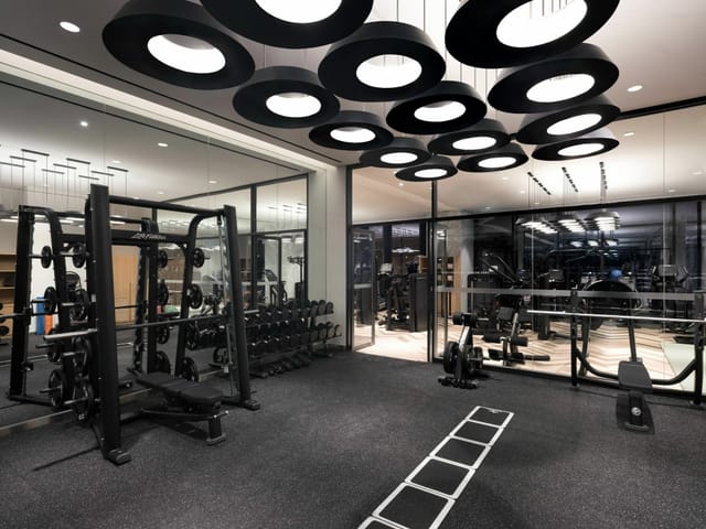 Modern fitness center in Novotel Ambassador Seoul Yongsan for corporate wellness events.