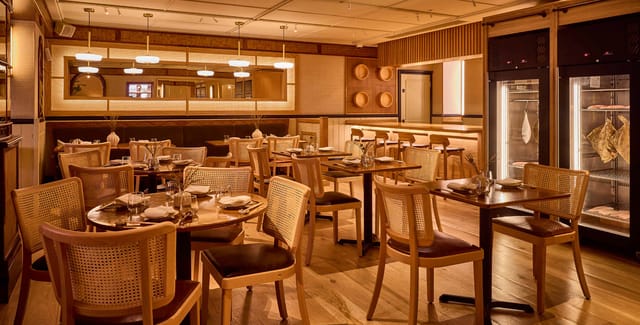 Elegant restaurant space with warm lighting for intimate gatherings and corporate events.