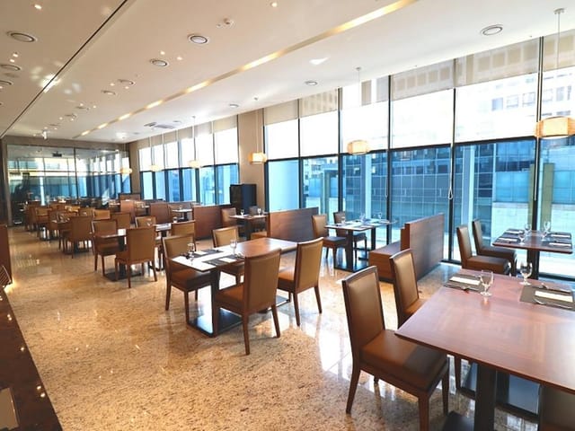 Modern dining space in Café Stanford Myeongdong, ideal for corporate meetings and events.