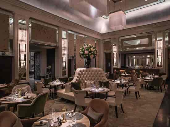 Elegant dining space in Palm Court, The Langham London for upscale events and meetings.