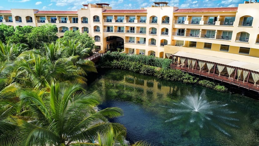 Pool area at Kimpton Tres Rios, ideal for events with lush greenery and serene water feature.