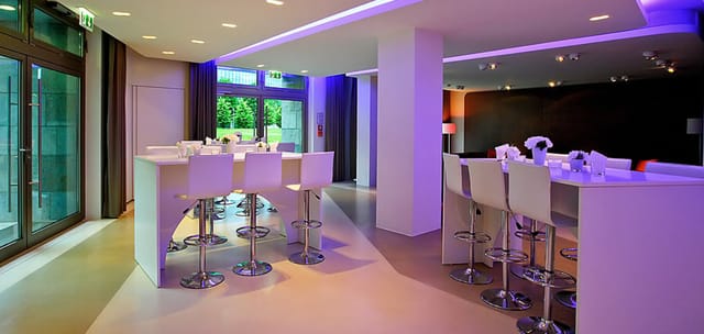 Modern event space in Berliner Freiheit with sleek furniture for networking and gatherings.
