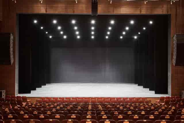 Spacious COEX auditorium with minimalist stage, ideal for events and presentations.