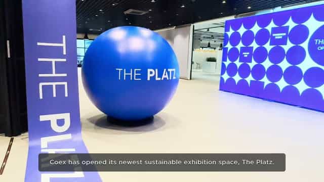 Modern exhibition space at COEX's The Platz with vibrant blue sphere, ideal for events.