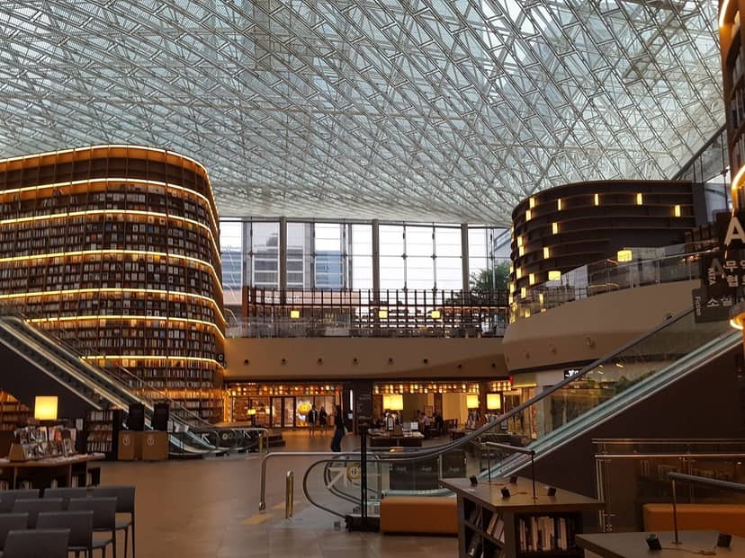 Modern library with glass ceiling at COEX, ideal for meetings and events.
